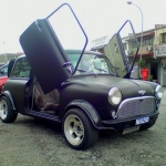 Matte black Mini Cooper with scissor doors